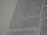 A close-up view of a page from a book, featuring columns of printed text with some words in uppercase for emphasis. The text appears neatly organized in paragraphs, and black ink is used on a white or slightly off-white paper background.