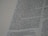 A close-up view of a page from a book, featuring columns of printed text with some words in uppercase for emphasis. The text appears neatly organized in paragraphs, and black ink is used on a white or slightly off-white paper background.