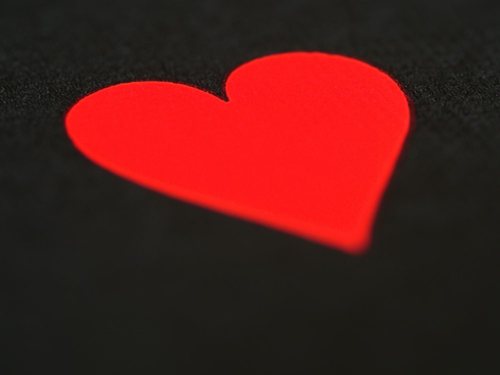 red heart with black background