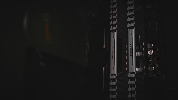 A set of RAM sticks laid out on a wooden table with soft lighting