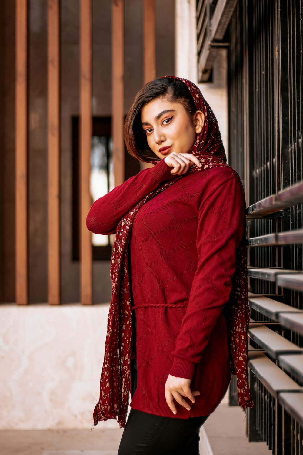 woman in red long sleeve dress standing on snow covered ground during daytime