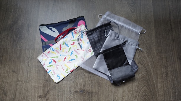 Assorted packaging bags and pouches neatly arranged on a wooden surface.