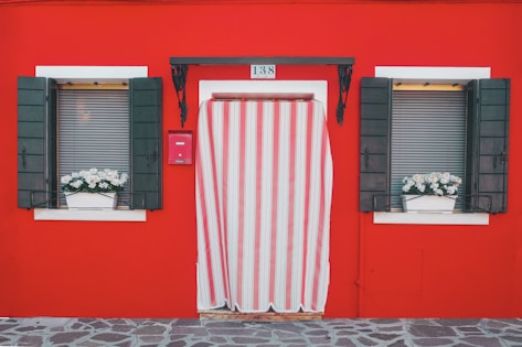 red and white wooden door