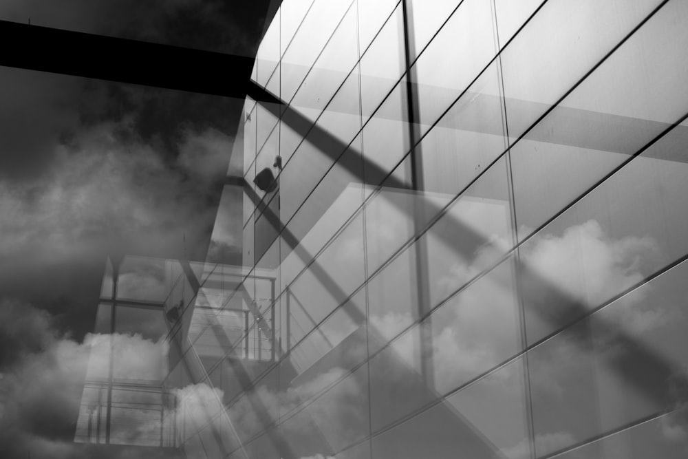 grayscale photo of glass building