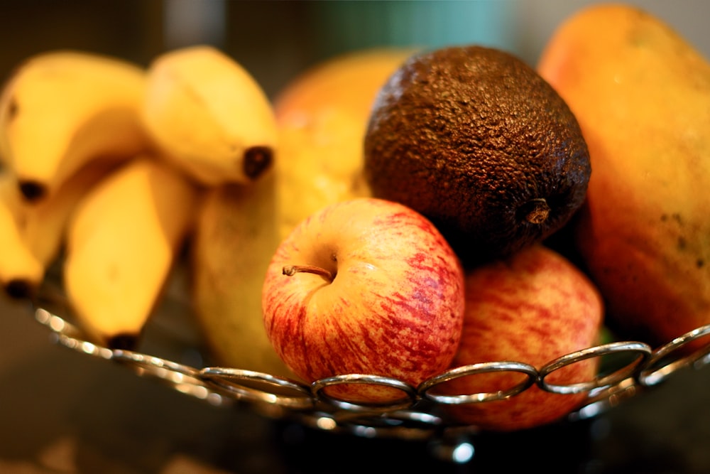 red apple fruit beside yellow banana fruit