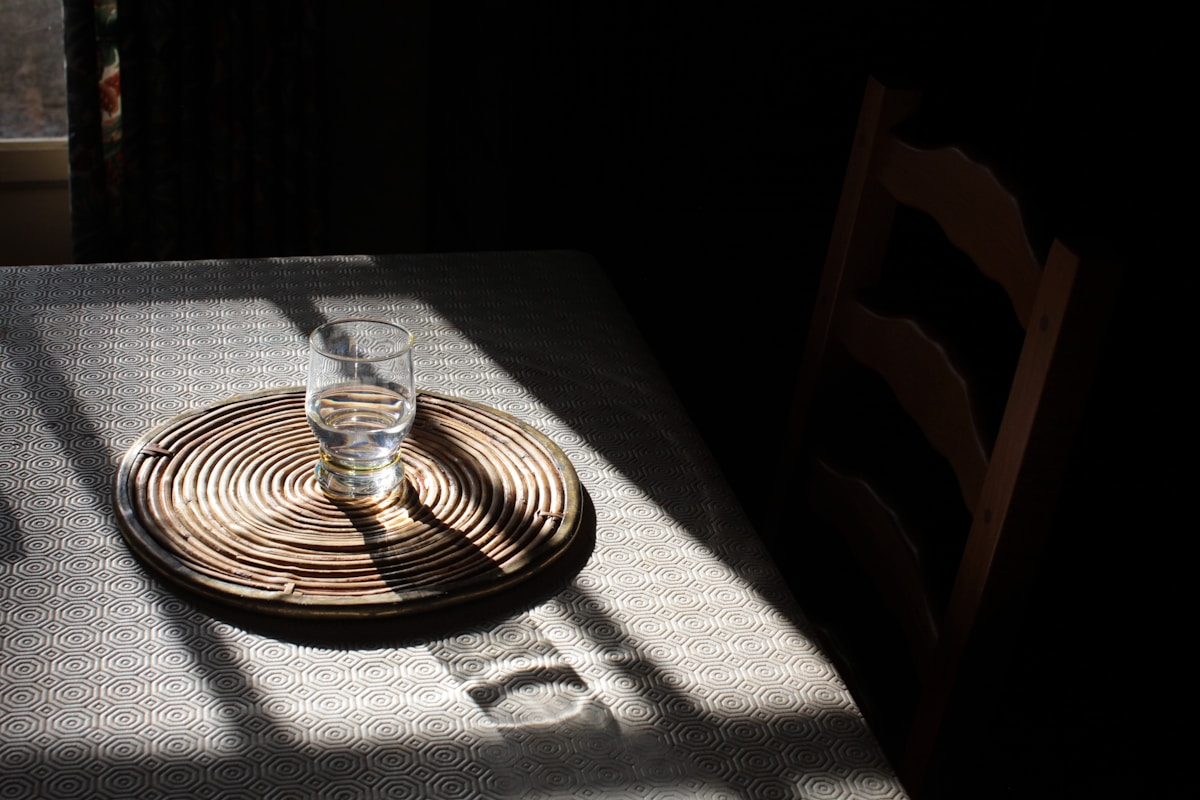 clear wine glass on brown round table