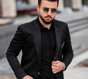 man in black suit jacket and black sunglasses