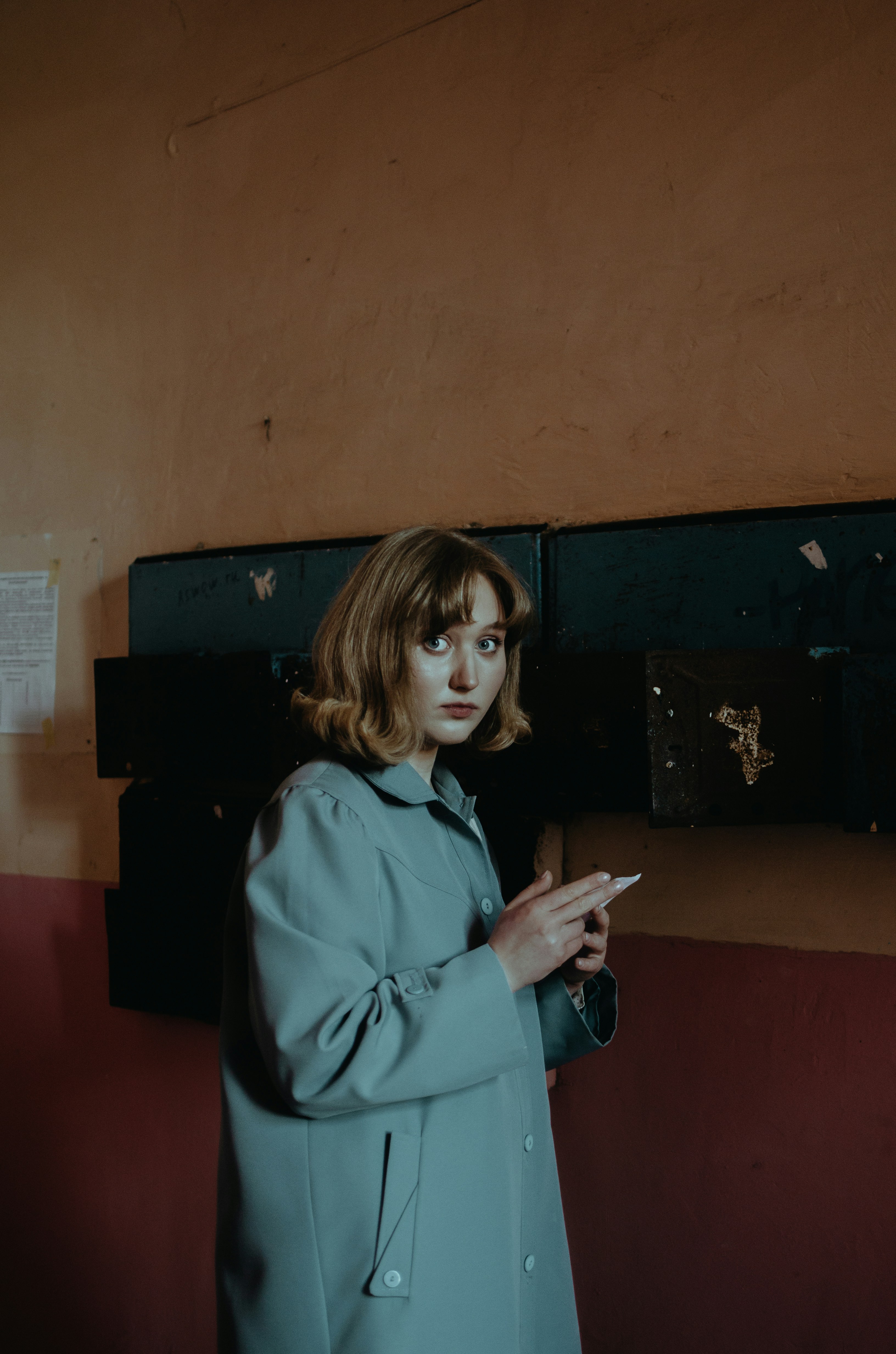 Woman in blue coat holding smartphone photo – Free Human Image on Unsplash