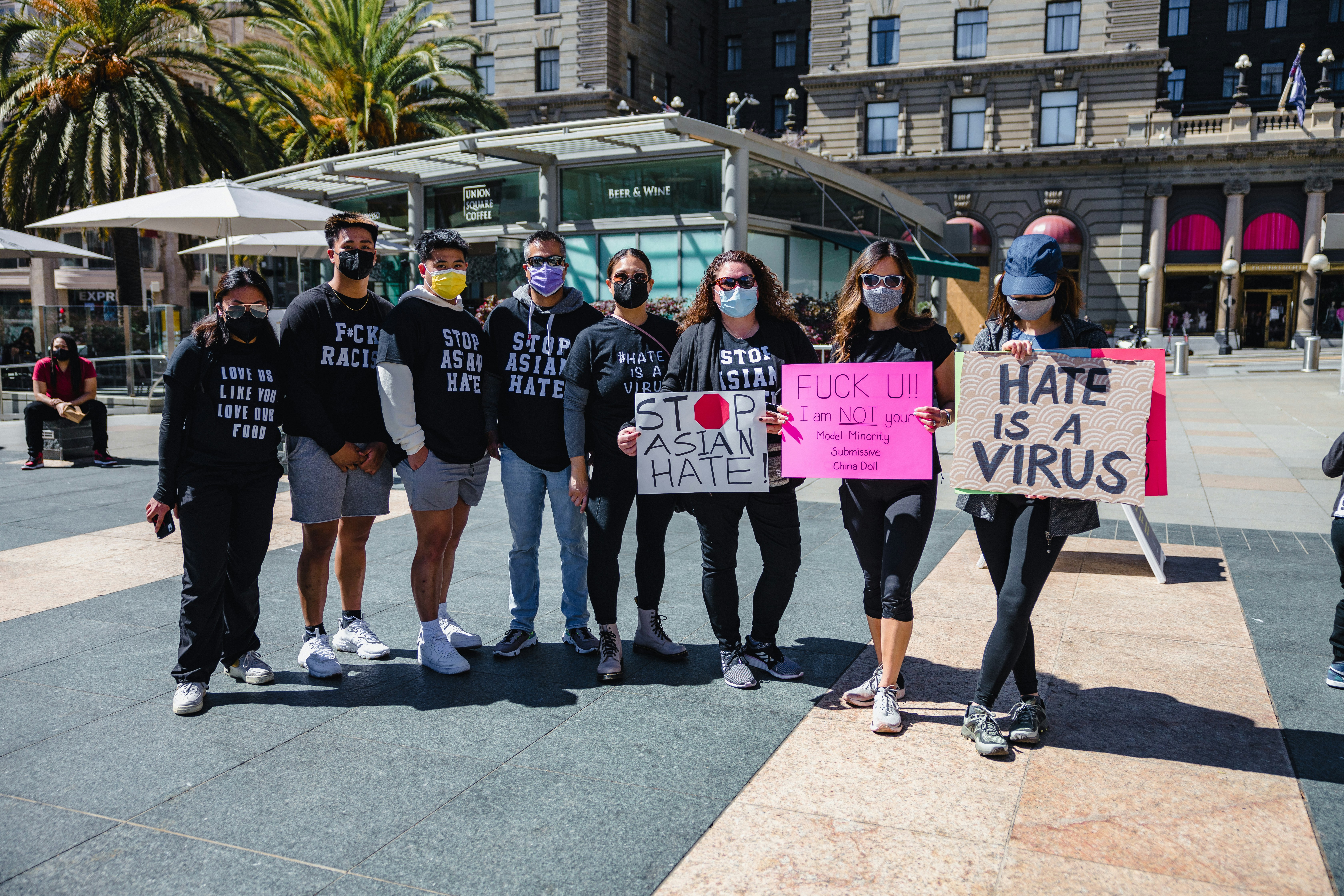 group of people standing on gray concrete floor during daytime