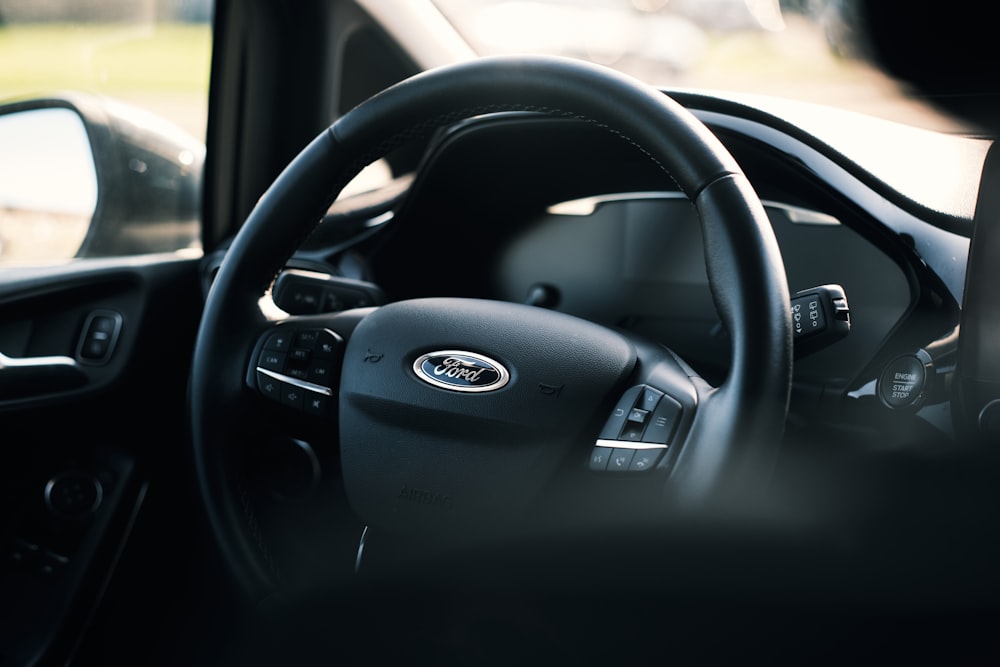 black nissan car steering wheel