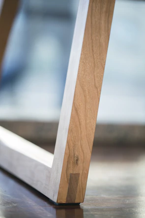 Close-up shot of handcrafted woodwork with natural textures and minimalist composition.