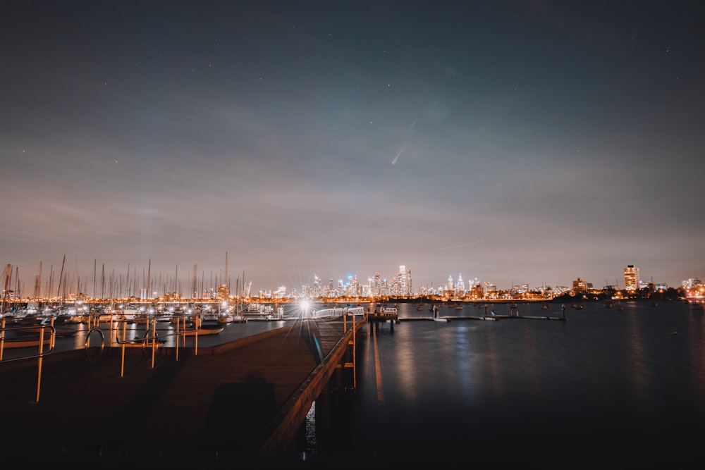 body of water near bridge during night time