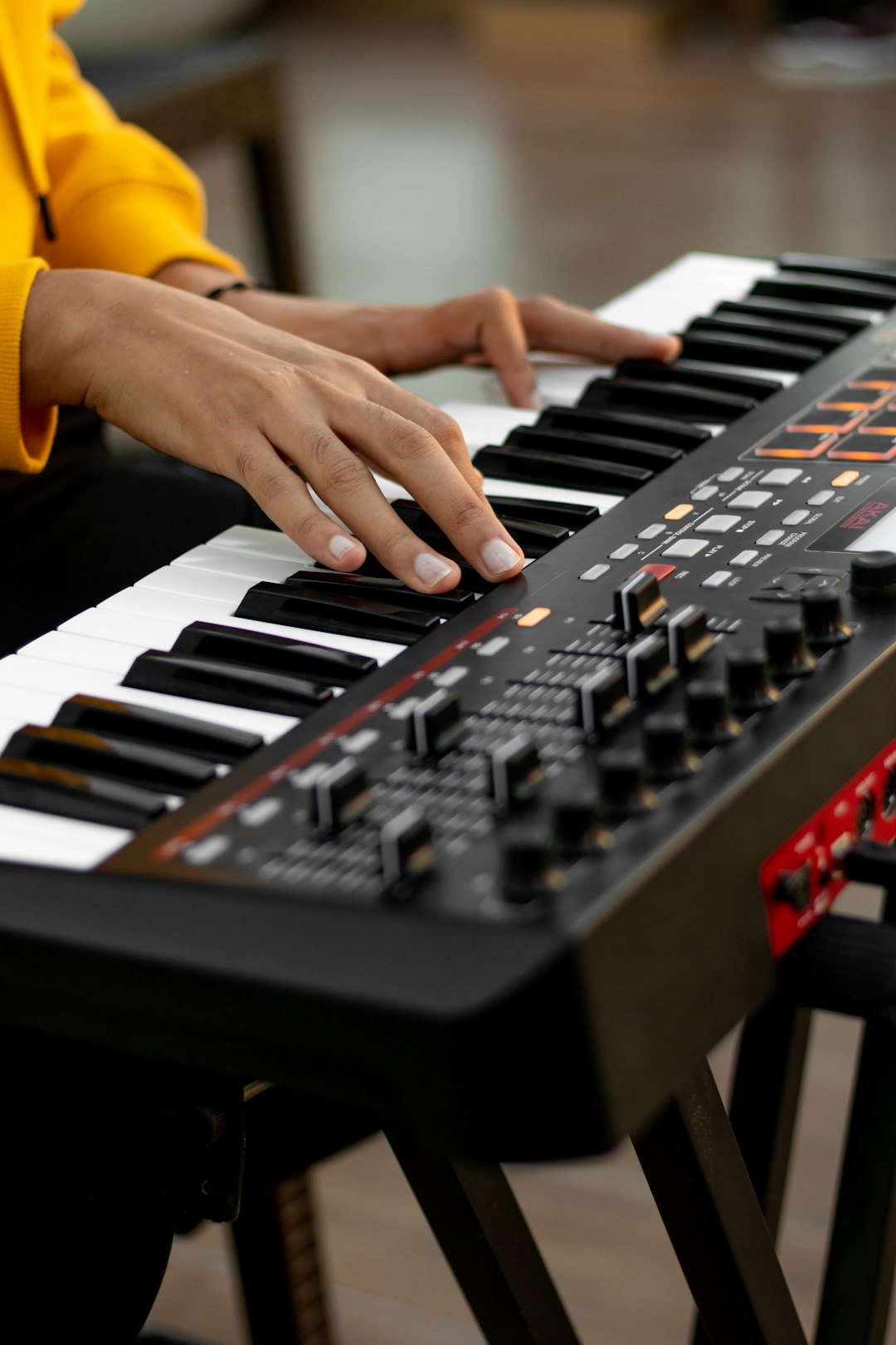 person playing black and white electric keyboard