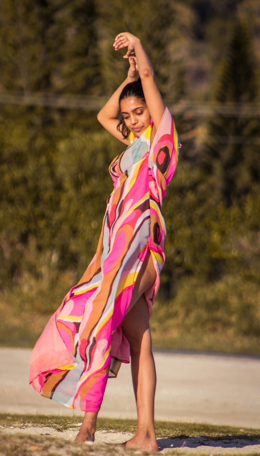 woman in pink yellow and purple dress