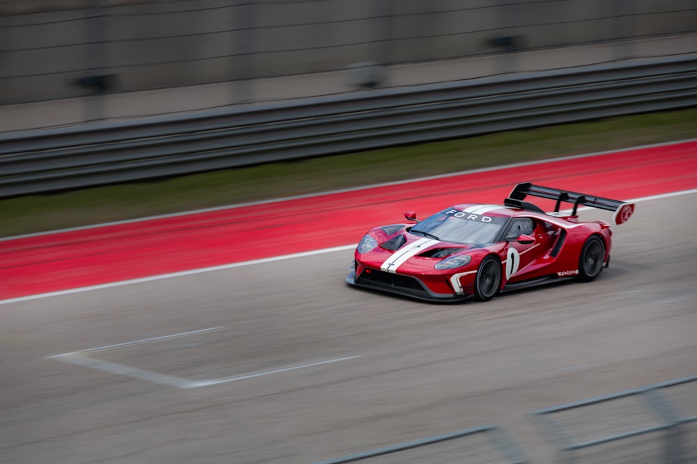 red and white ferrari f 1 on track