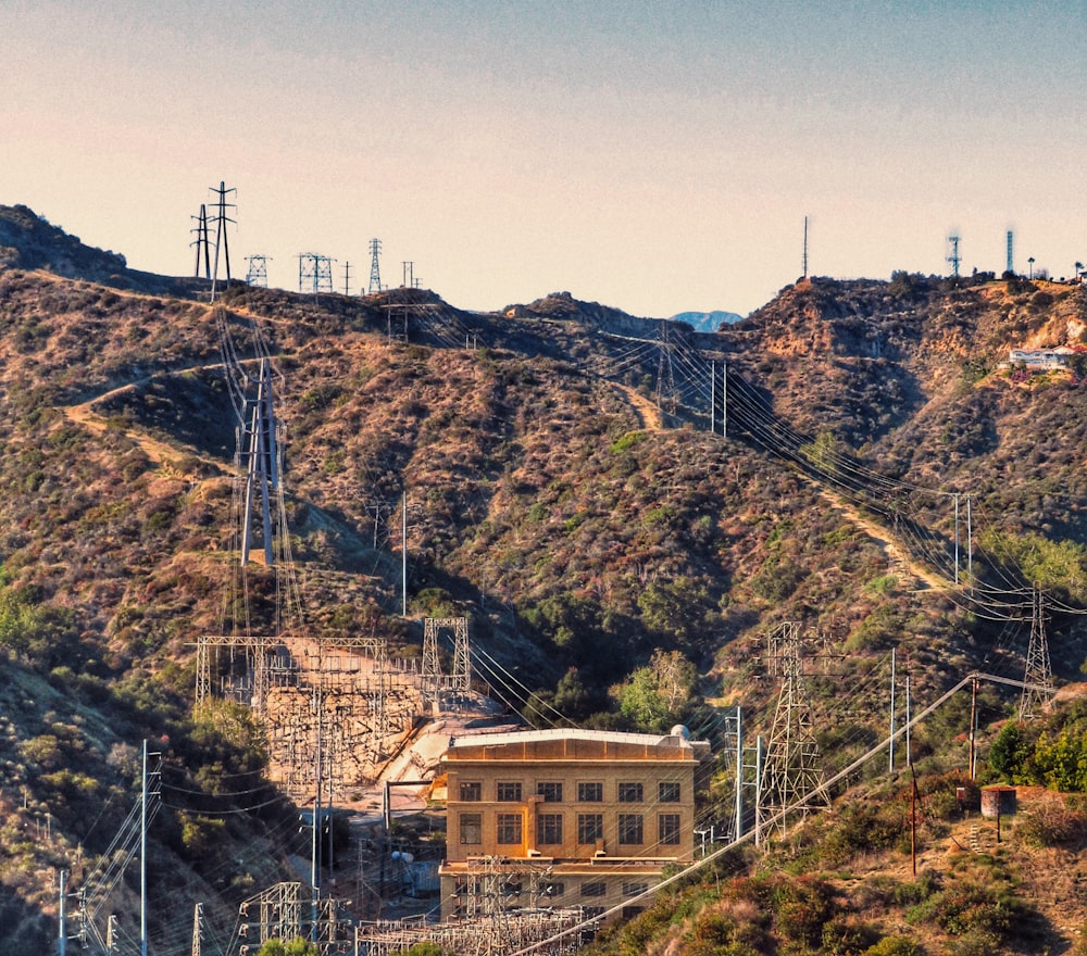 brown concrete building on top of mountain during daytime