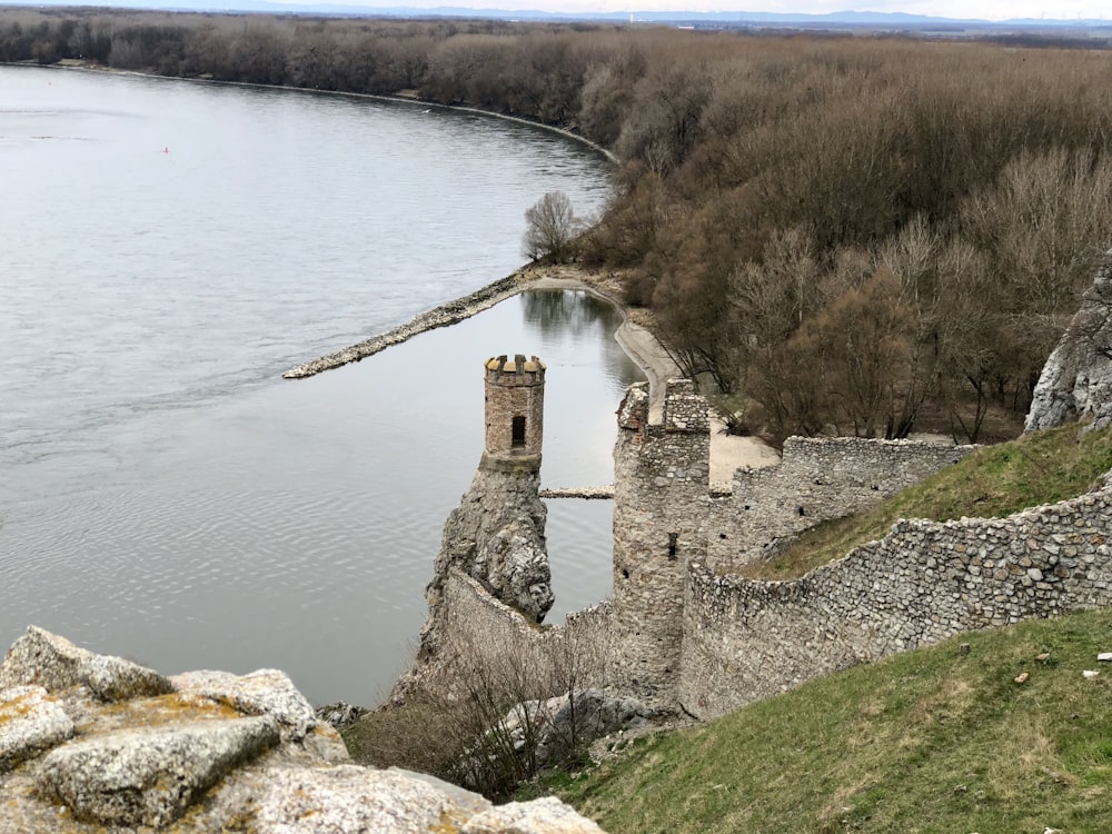 gray concrete building near body of water during daytime