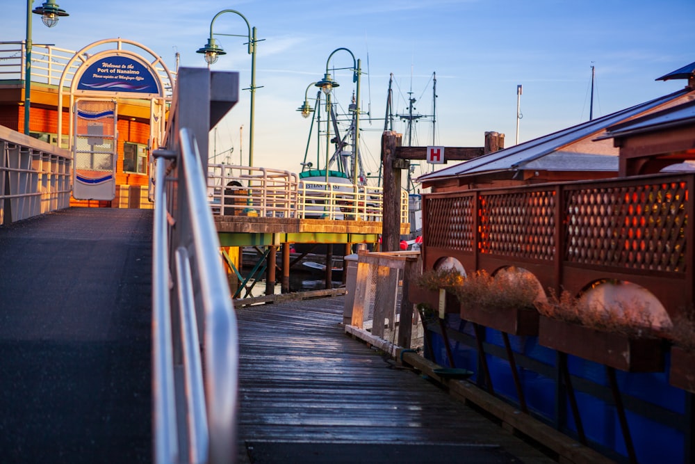 yellow and blue metal crane on dock during daytime