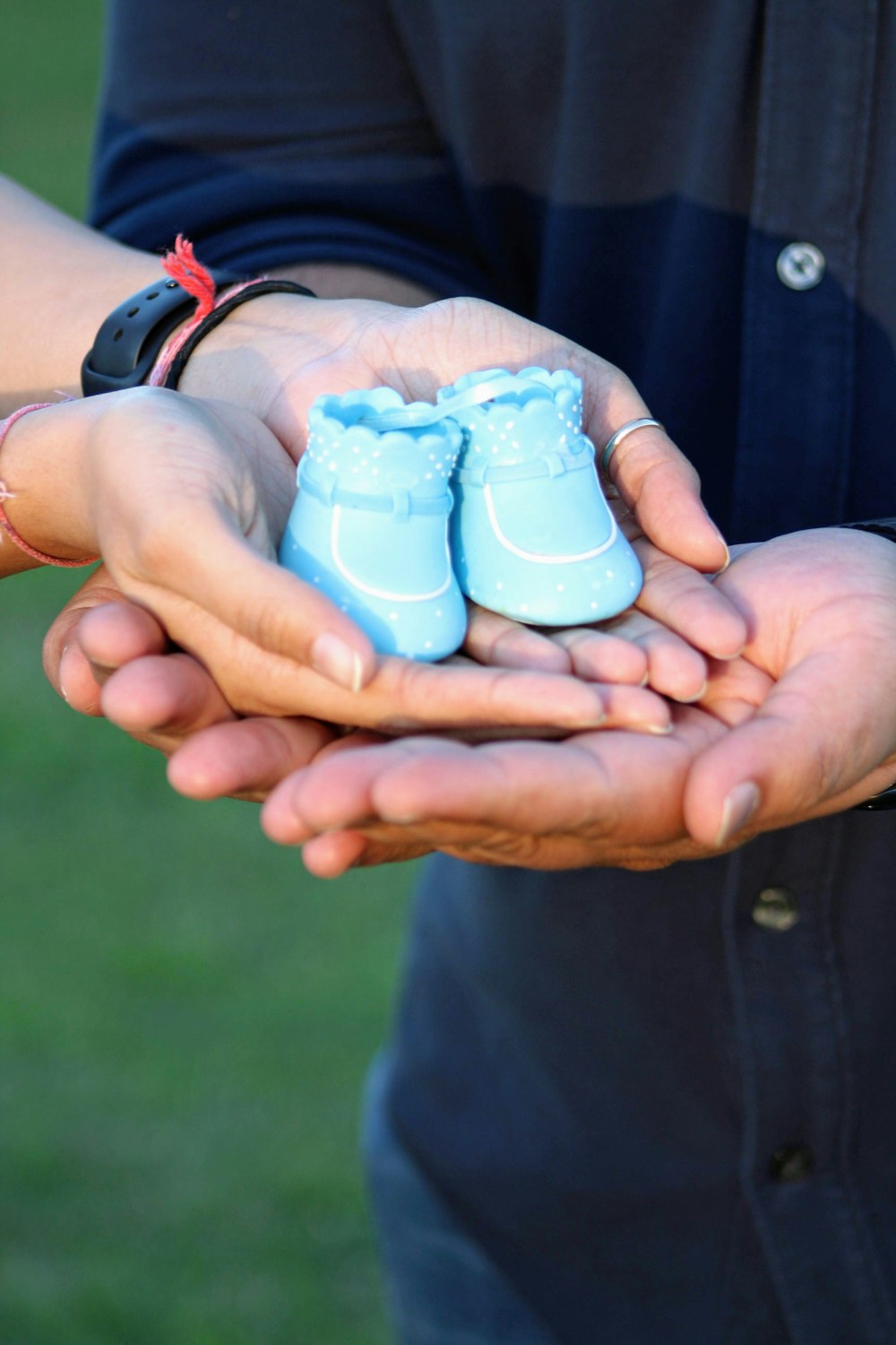 person holding blue and white plastic toy