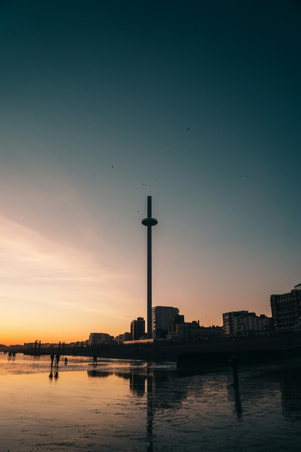 silhouette of city buildings during sunset