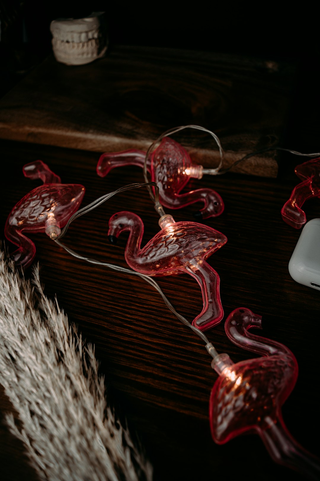 red glass water bong on brown wooden table