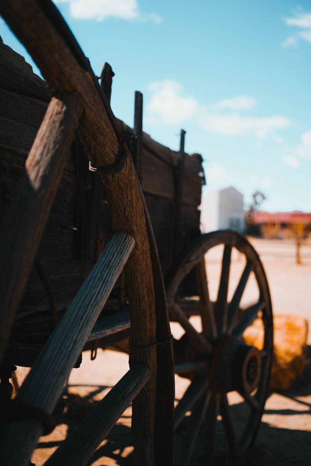 brown wooden wheel on brown wooden stand during daytime