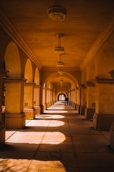 brown and white hallway with white and brown floor tiles