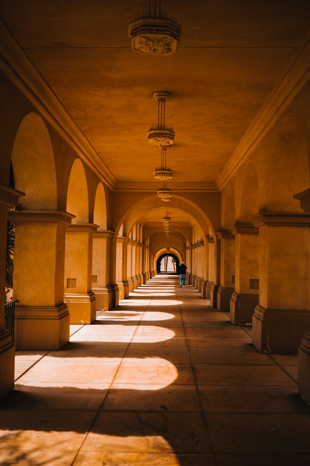 brown and white hallway with white and brown floor tiles