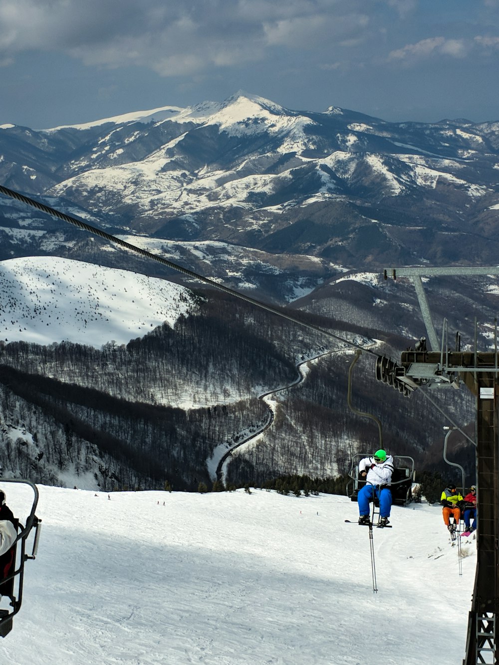 people hiking on snow covered mountain during daytime