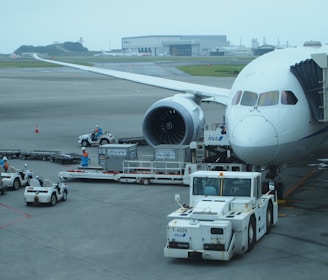 white airplane on airport during daytime