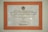 A framed plaque with a beige marble pattern background and a bold orange border featuring Indonesian text. The plaque is a commemoration from Yayasan Amalbakti Muslim Pancasila, dated June 14, 1996, and includes a signature at the bottom.