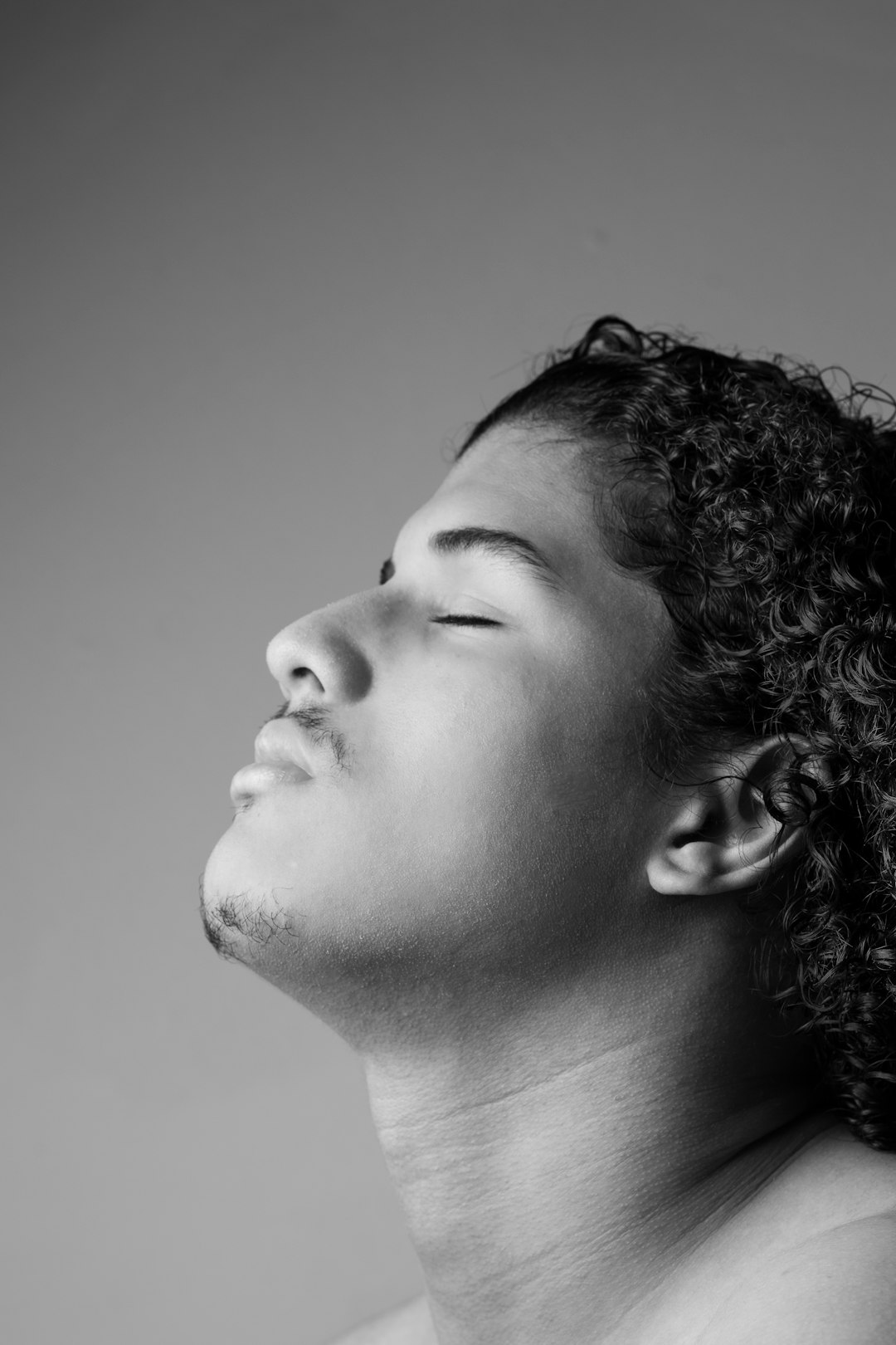 grayscale photo of womans face