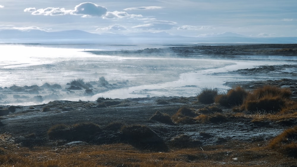 ocean waves crashing on shore during daytime