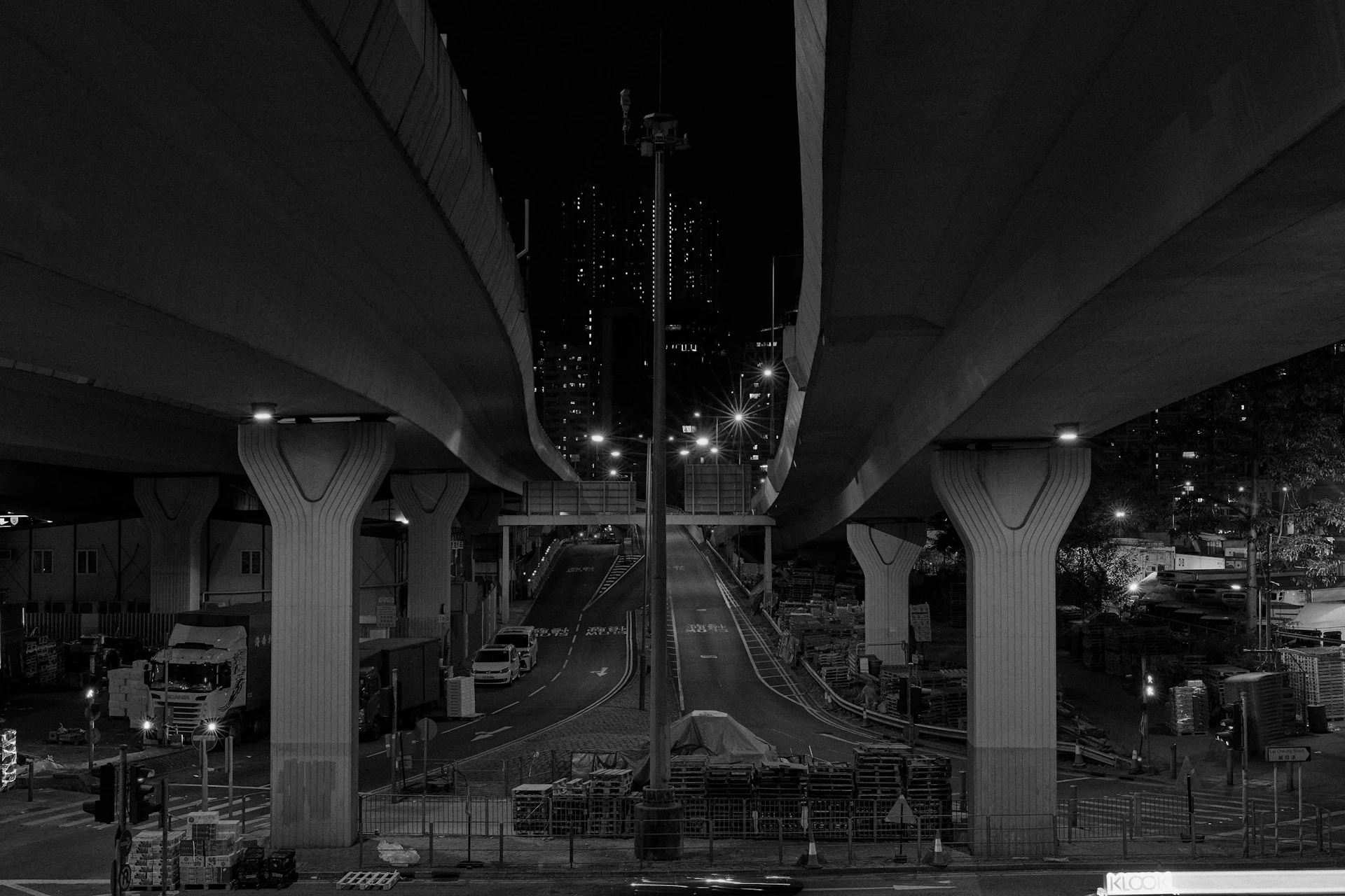 grayscale photo of cars on road