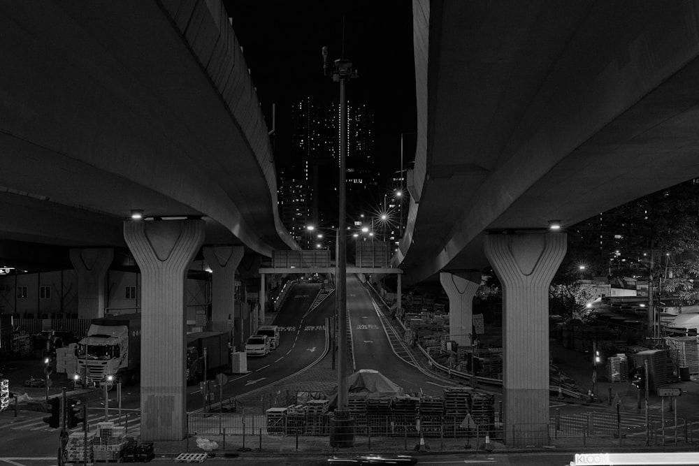 grayscale photo of cars on road