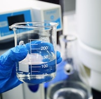 clear glass measuring cup on white table