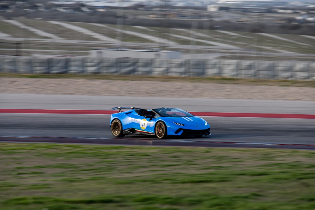 blue porsche 911 on road during daytime