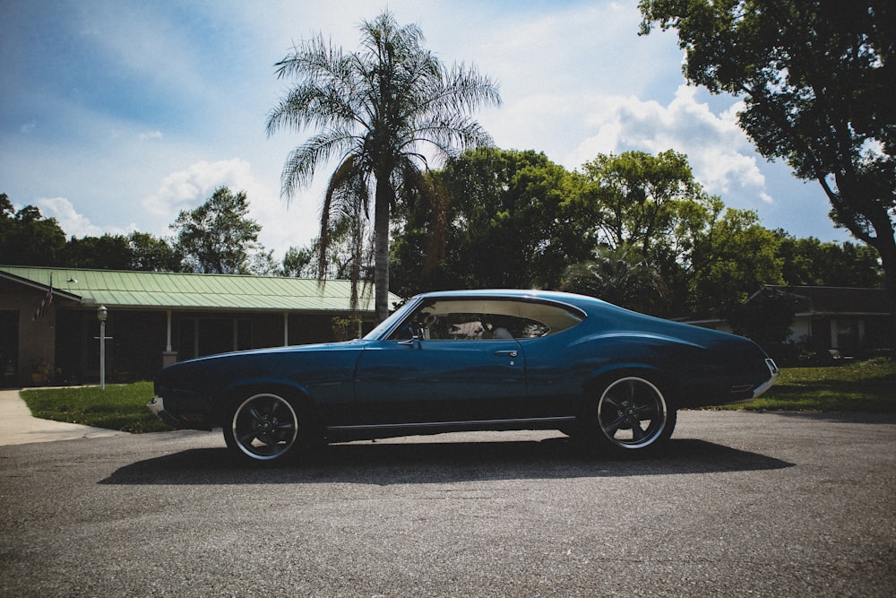 blue chevrolet camaro on road during daytime