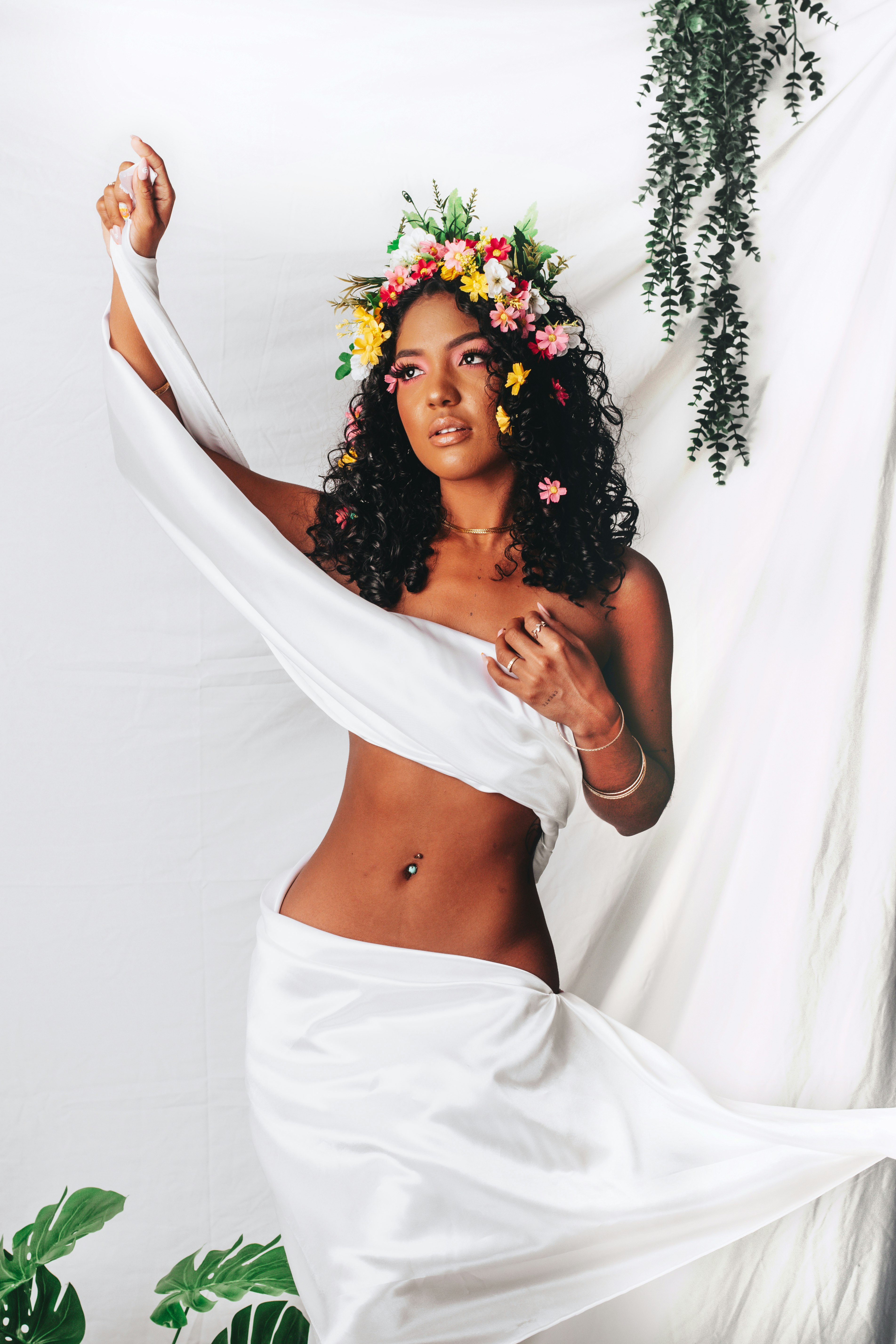 woman in white tube dress with floral headdress