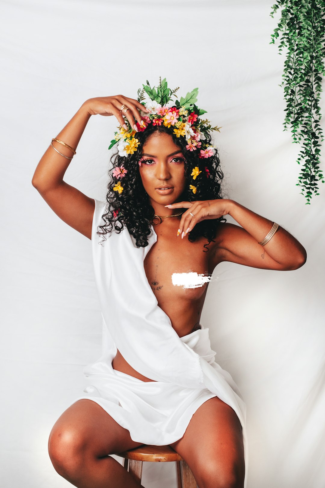 woman in white dress holding bouquet of flowers