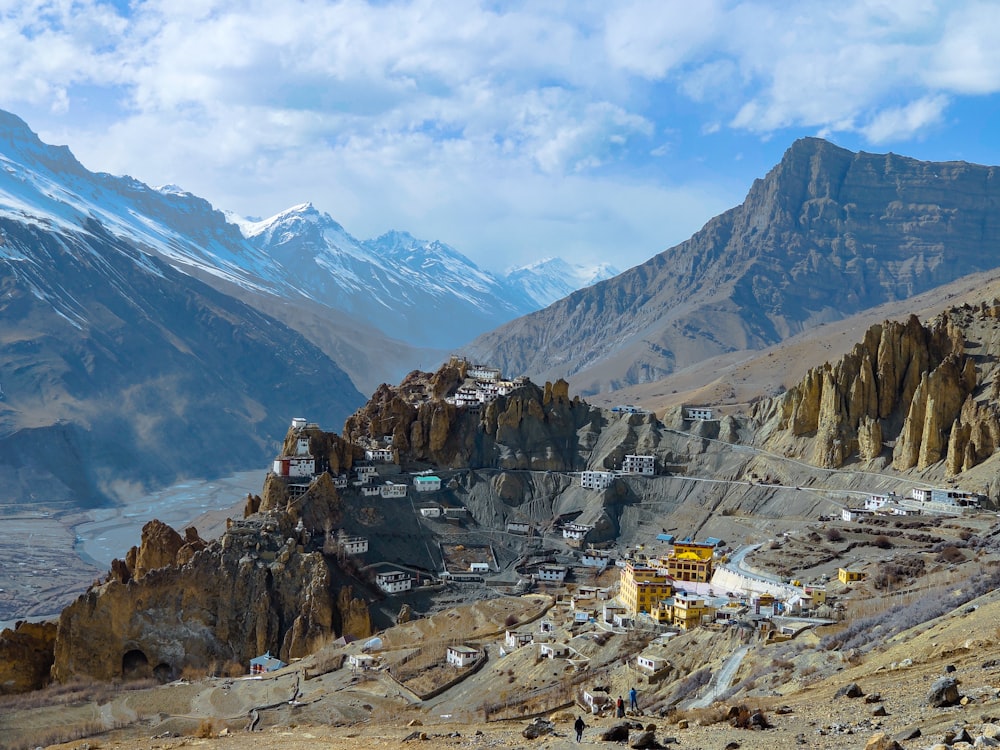 white and brown houses on mountain under blue sky during daytime