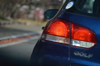 The Volkswagen Golf’s rear view highlighting its sporty tail lights and clean lines.