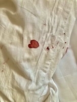 A before-and-after comparison of stained and cleaned garments.