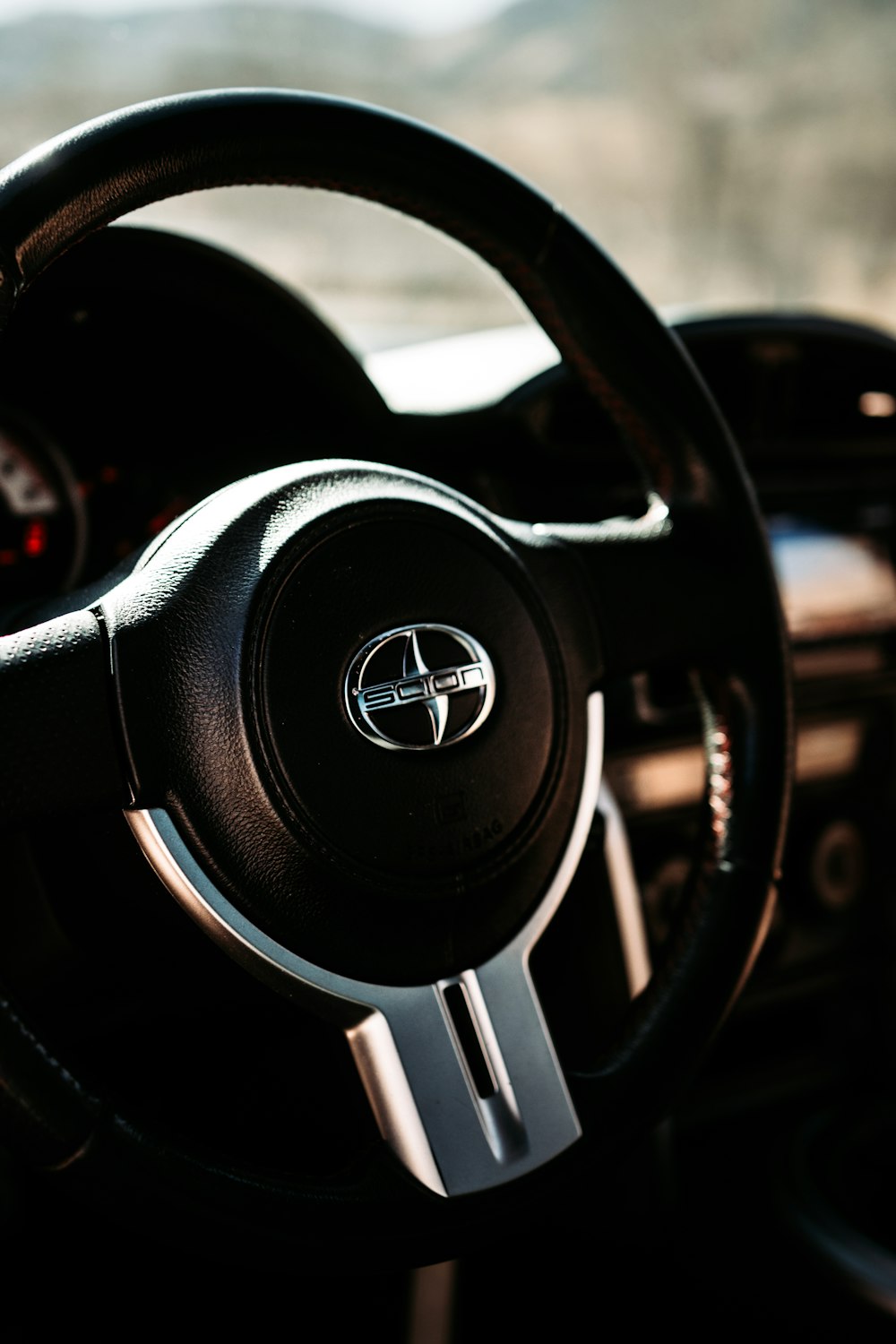 black and silver mercedes benz steering wheel