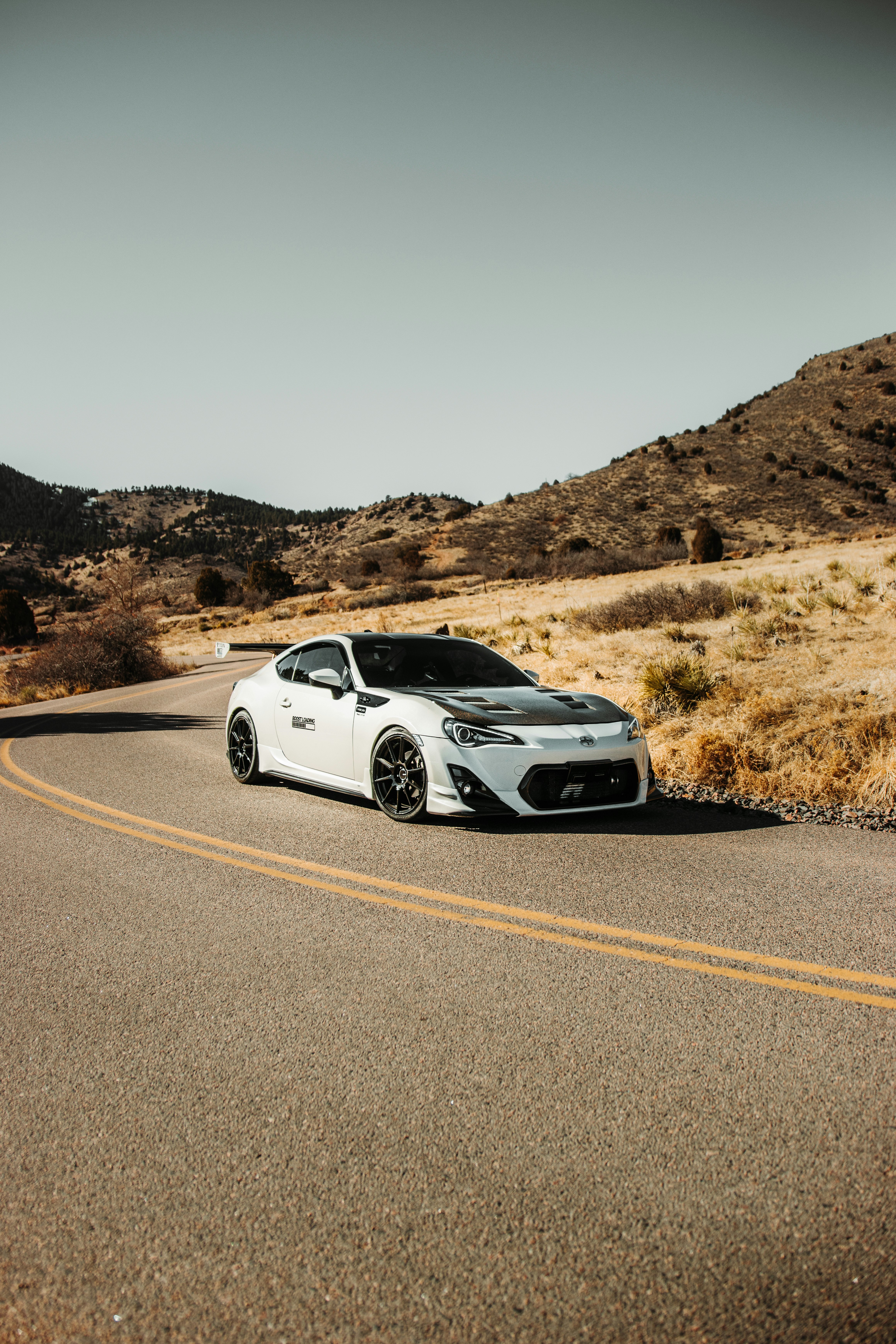 white car on road during daytime