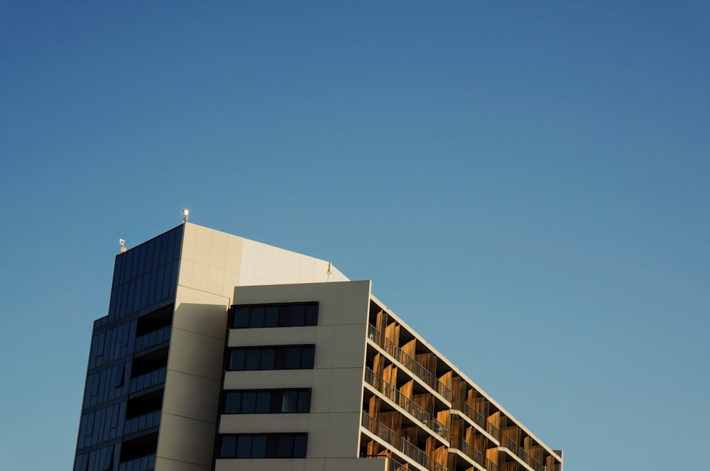 white and brown concrete building under blue sky during daytime