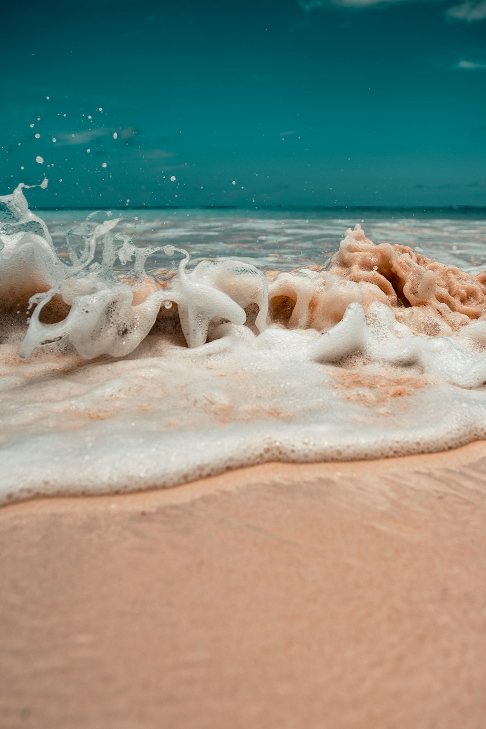 white sand on beach during daytime