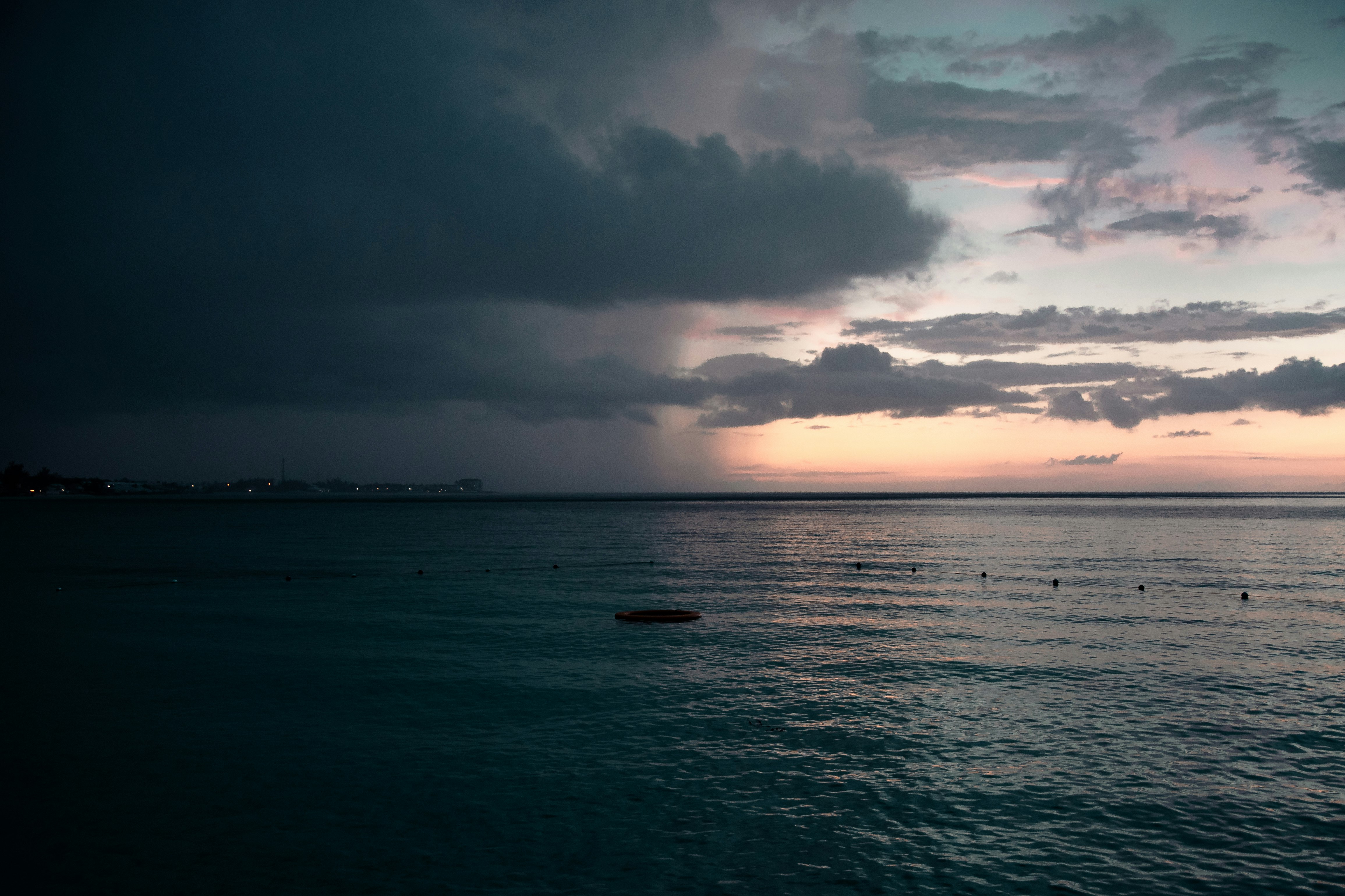 body of water under cloudy sky during daytime