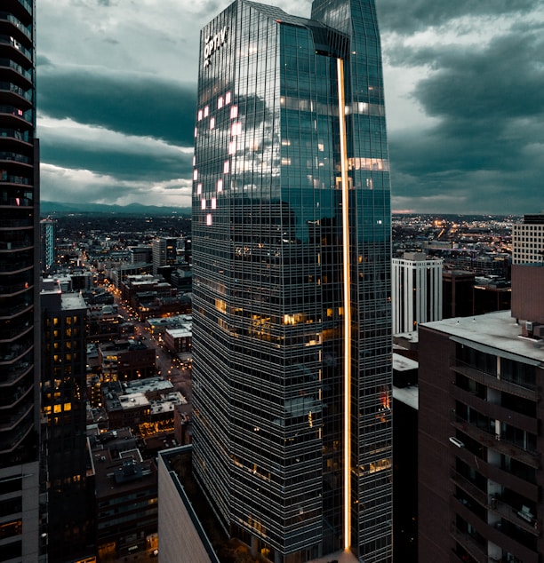 high rise buildings under gray clouds during daytime