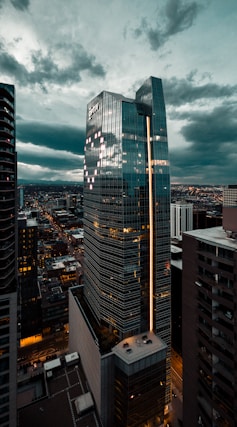 high rise buildings under gray clouds during daytime
